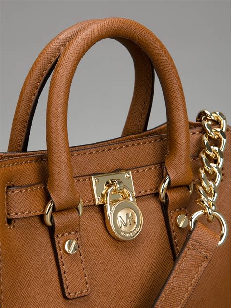 michael kors brown and red purse|Michael Kors brown shoulder bag.